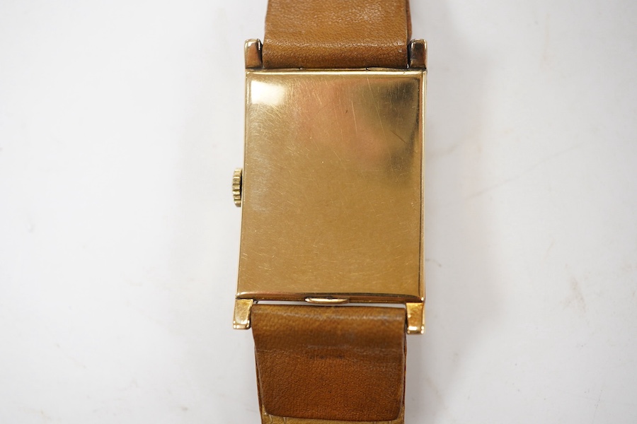 A gentleman's 1930's/1940's 14k gold Zenith manual wind wrist watch, with rectangular Arabic dial and subsidiary seconds, case diameter 25mm, on a later associated leather strap. Condition - fair